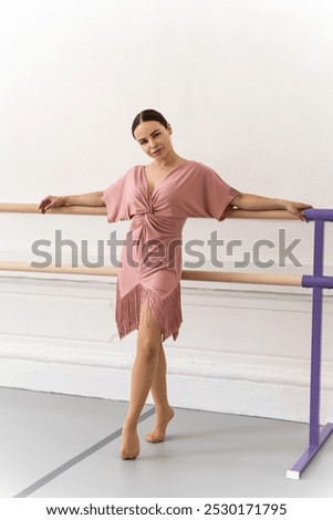 Similar – Image, Stock Photo Ballerina standing on tiptoe classical position outside