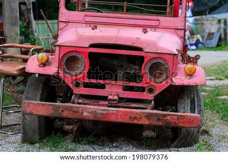 An old wrecked of red fire truck