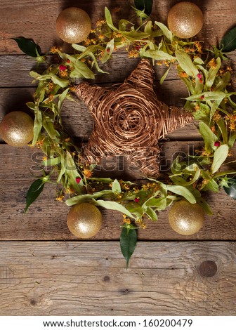 Christmas composition with linden blossom on old wooden table