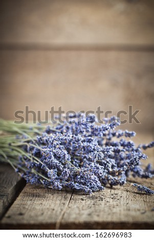 Bunch of lavender flowers on an old wood table