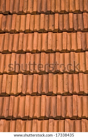 A red tile roof with repeating patterns for background or texture