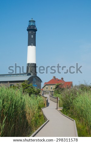 Fire Island, New York: June 18, 2015. Boardwalk to lighthouse at Fire Island National Seashore, a barrier island off the southern coast of Long Island, New York. A short walk from Robert Moses beach
