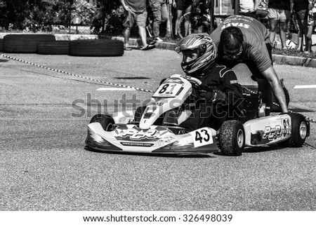 Cantu , Italy -7 September 2014 : exhibition open to the public go-kart : power kart black and white