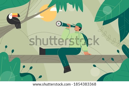 Explorers, travelers in the jungle large green leaves. Man Looks at the Toucan bird through binoculars. Concept of discovery, exploration, hiking, adventure tourism and travel.