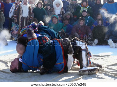 NADYM, RUSSIA - March 15, 2008: National Holiday - Day of the reindeer herders. The wrestling unknown men on holiday in Nadym, Russia - March 15, 2008.