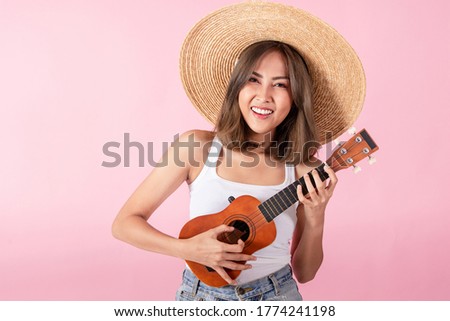 Similar – Image, Stock Photo young woman playing ukulele