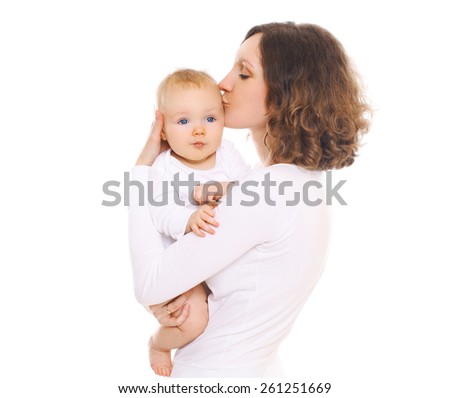 Portrait of happy young mom kissing her baby