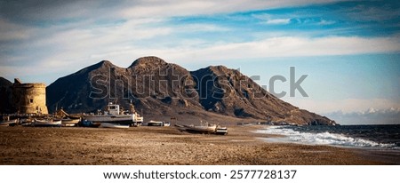 Similar – Image, Stock Photo Sandy seashore near hill with houses under cloudy sky