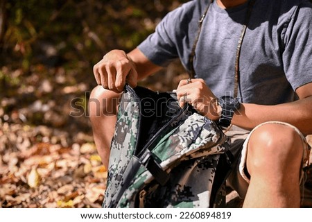 Similar – Image, Stock Photo Crop traveler with trekking poles in mountains in winter