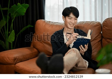 Similar – Image, Stock Photo Relaxed man reading notes in notebook