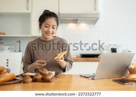 Image, Stock Photo Housewife making strawberry jam. Woman cutting fruits