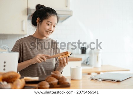 Similar – Image, Stock Photo Housewife making strawberry jam. Woman cutting fruits