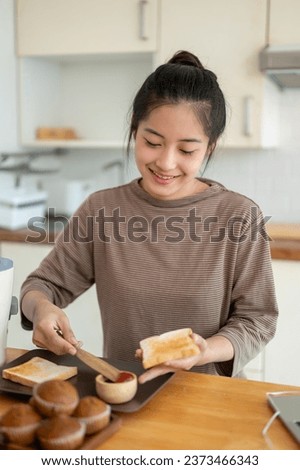 Similar – Image, Stock Photo Housewife making strawberry jam. Woman cutting fruits