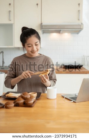 Similar – Image, Stock Photo Housewife making strawberry jam. Woman cutting fruits