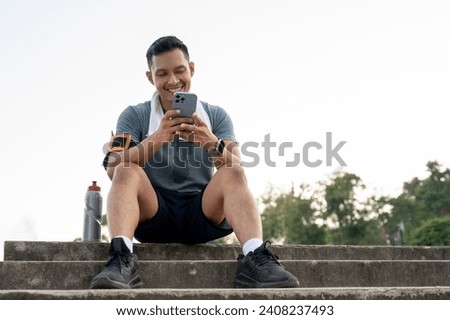 Similar – Image, Stock Photo Athletic man using his mobile phone.