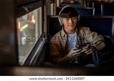 Similar – Image, Stock Photo Male passenger with seat belt fastened while sitting on airplane for safe flight.