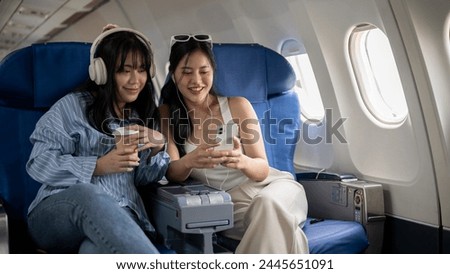 Similar – Image, Stock Photo Female traveler talking on her cell phone while waiting to board a plane at departure gates at airport terminal.