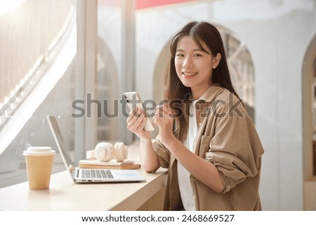 Similar – Image, Stock Photo A woman holds a book up to the cloudy sky and reads