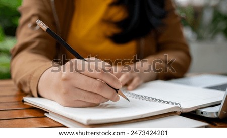 Image, Stock Photo Crop businesswoman making notes in notepad