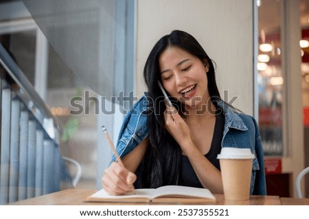 Similar – Image, Stock Photo Female freelancer taking notes in notebook