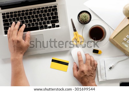 A man use laptop for Online shopping ,top view shopping online
