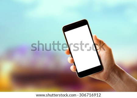 Hand holding smartphone device.
