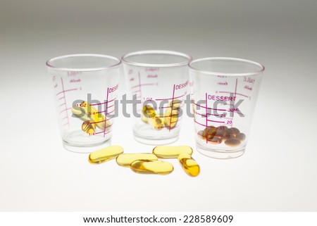 Pills in a cup of glass