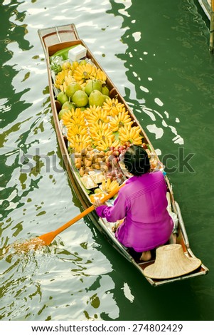 Reflect light in river,Floating market,Woodenboats,Damnoen Saduak,Thailand