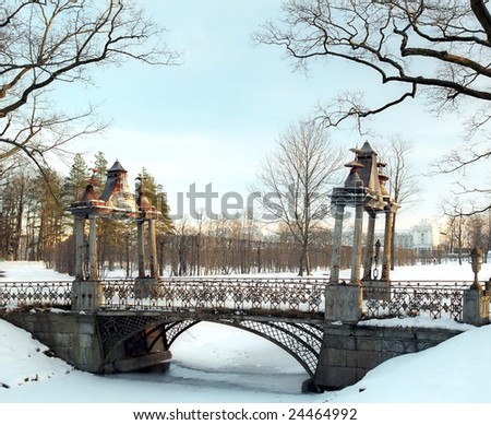 Old metal chinese bridge over winter aqueduct