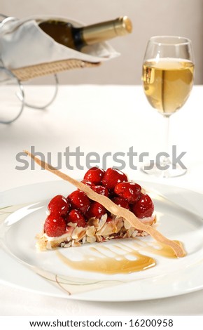 strawberry tart with glass of wine