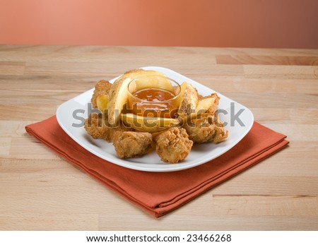 Fried chicken drumstick with potato ant sweet sauce