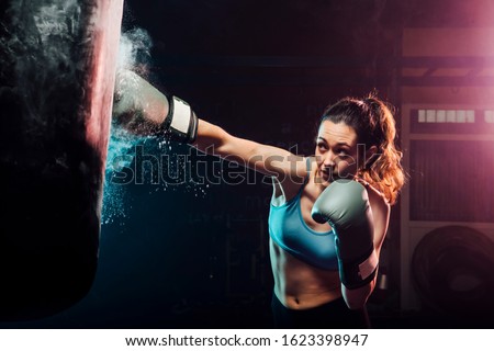 Similar – Foto Bild Kickbox-Kämpfer-Training in einem Fitnessstudio mit Boxsack.