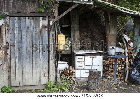 Old run-down kitchen and outdoor wooden doors