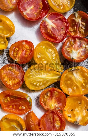 Yellow and red tomatoes dried in the sun
