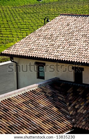 Tiled roofs and vines of a California vineyard