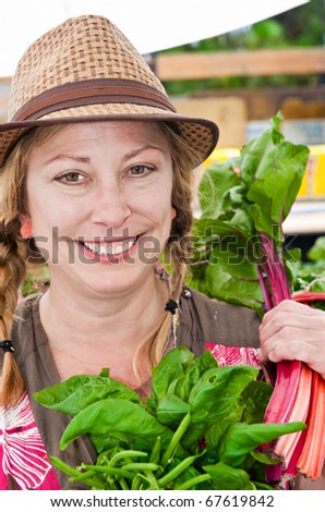 A farm woman in a hat posing for a photograph