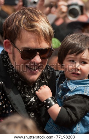 SANTA CRUZ, CA - MAY 14: American Idol performer James Durbin carries his son Hunter to a hometown event at the Loudin Nelson Community Center on May 14, 2011 in Santa Cruz, CA.