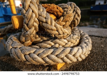 Similar – Image, Stock Photo Coil of used mooring ropes.