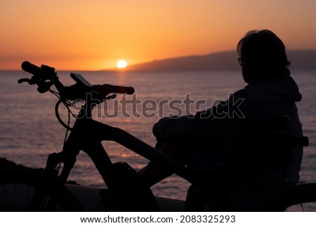 Similar – Image, Stock Photo Positive female cyclist resting on street