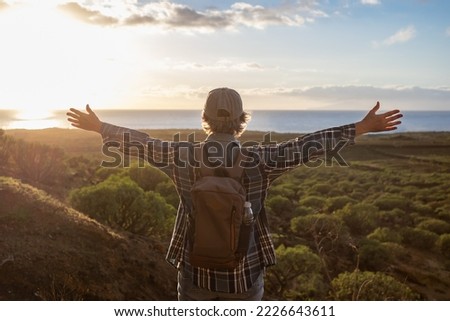 Image, Stock Photo Senior lady admiring sunset over ocean from boardwalk