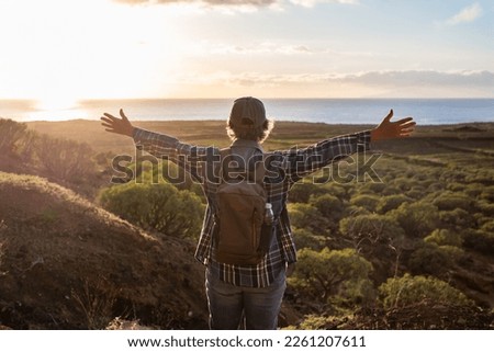 Similar – Image, Stock Photo Senior lady admiring sunset over ocean from boardwalk