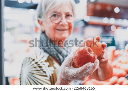 Similar – Image, Stock Photo old woman wearing protective mask holding hands with unrecognizable woman. New normal concept