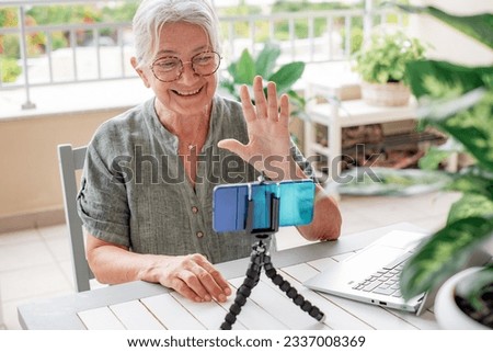 Similar – Image, Stock Photo Senior influencer working at table in modern workplace