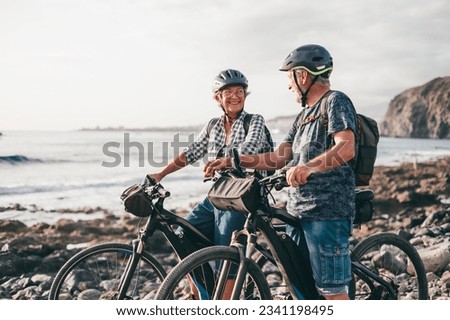 Similar – Image, Stock Photo Active sporty couple riding mountain bikes on demanding forest trail.