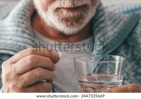 Similar – Image, Stock Photo Senior man taking prescription medicine at home