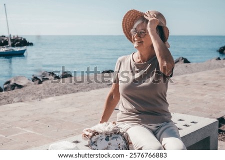 Similar – Image, Stock Photo Woman holding her hat wearing a bikini