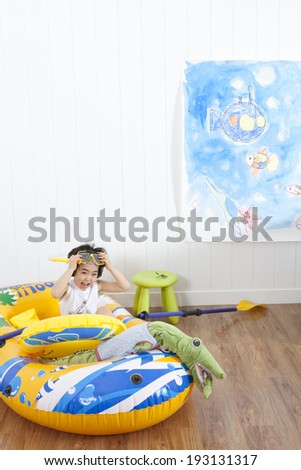 the image of cute Asian inside blow up boat