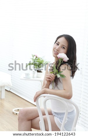 the image of Asian woman and flowers