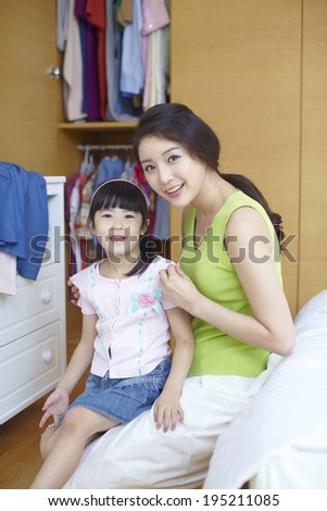the image of a happy Asian family, mother and daughter