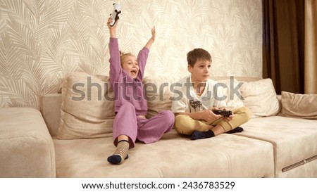 Similar – Image, Stock Photo Brother and sister playing on the field at the day time. Children having fun outdoors. They running on the lawn. Concept of friendly family.